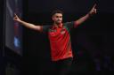 Cardigan dart ace Jamie Lewis sees off Peter Wright in the second round of the William Hill World Darts Championship. PIC;Lawrence Lustig/PDC