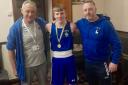 Cardigan ABC Junior Dion Jones – flanked here by Cardigan ABC head coach Guy Croft and assistant coach Rob Thomas – had twin cause for celebration this week.
