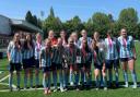 Ceredigion's Under 15s girls with the cup