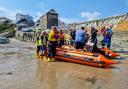 The New Quay RNLI crew pictured bringing the father ashore at New Quay where he was met by paramedics.