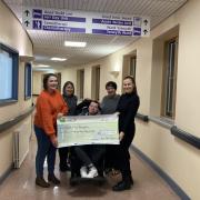Ann Jones and her children Llyr, Gwenan and Ffion presenting a cheque to Dr Elin Jones of Bronglais Hospital. Picture: Hywel Dda Health Charities
