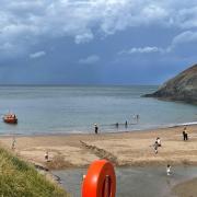 Cardigan RNLI pictured at Sunday's rescue off the cliffs at Mwnt