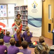 Joseph Coelho was joined at Lampeter Library by pupils from Ysgol Bro Pedr.