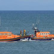 The old and new lifeboats at New Quay