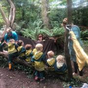 The playgroup is using the local woods to help children explore