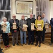 : Aberporth councillors including county councillor Gethin Davies (right) show off the new nest boxes.