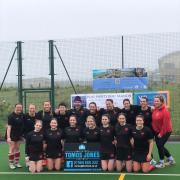 Newcastle Emlyn Ladies Hockey Club secured promotion to Premier 2 League after a win over Bridgend