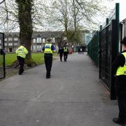 Police officers outside Ysgol Dyffryn Aman.