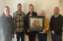 Pictured are CAS members (from left): Nick Newland, Clive Davies, Bill Hamblett, Kathleen Martin and Adrian Lawes with the Lizzie Ellen painting.