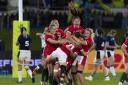 GLORY: Wales celebrate their last-gasp win over Scotland