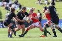 SURROUNDED: Wales' Elinor Snowsill is tackled by the New Zealand defence