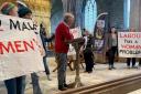 Silent protestors during First Minister Mark Drakeford's talk at the St Davids Festival of Ideas.