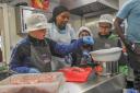 Children take part in cooking sessions run by Steps4Change at Butetown Pavilion in Cardiff.