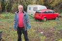 I shall not be moved: ‘Land pirate’ Neil Parker is pictured on the contested plot of land off the A487 at Tremain.