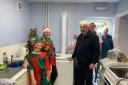 Mike Harwood and community co-ordinator Nic King with volunteers at the recent Christmas fair in Canolfan Dyffryn.