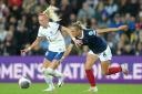 England’s Chloe Kelly, left, and Scotland’s Samantha Kerr battle for the ball in September’s meeting (Owen Humphreys/PA)