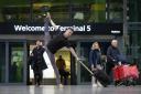 Dancer Dan Corthorn performs a Christmas ballet titled The Reunion at Heathrow’s Terminal 5 Arrivals, celebrating the emotion of festive reconnections at the airport (Matt Alexander/PA)