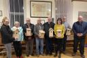 : Aberporth councillors including county councillor Gethin Davies (right) show off the new nest boxes.