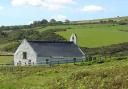 Cardigan councillor Clive Davies believes Mwnt Church can be made more secure.
