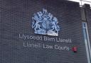 The defendant was remanded in custody to appear before Carmarthenshire magistrates sitting at Llanelli on January 5.