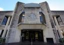 Saxton admitted assaulting a police officer when he appeared at Swansea Crown Court.