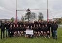Crymych Rugby Club with the James family and the cheque for £30,000