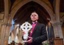 Archbishop of Wales Andrew John with the Cross of Wales ahead of a blessing service (Peter Powell/PA)