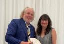Founders Gillian Griffiths and Richard Davies hold the rugby ball that attendees signed on the first ever Parthian book launch