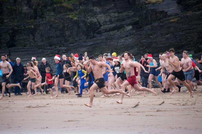 Aberporth's Boxing Day Swim has grown in popularity over the years and invariably draws a large entry. Photo: Emyr Rhys Williams.
