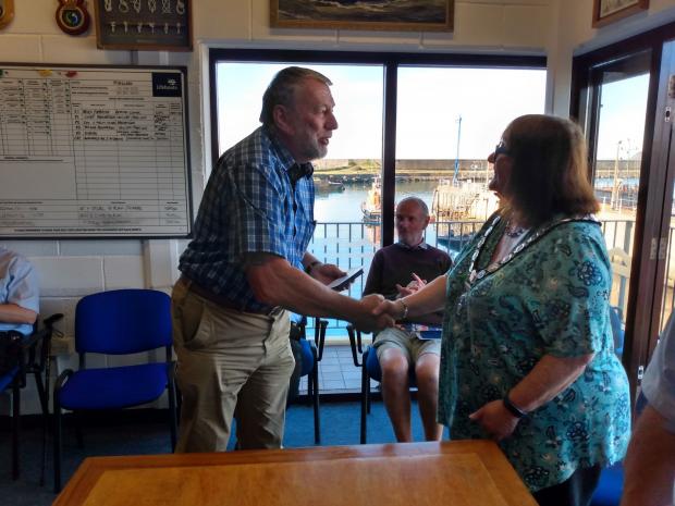 Tivyside Advertiser: Deputy launching authority Chris Williams receives his medal