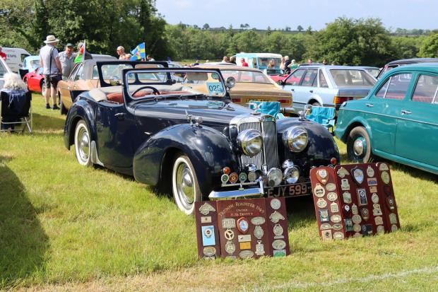 Tivyside Advertiser: Peter Badham, club secretary, then presented a silver salver to Anthony Coles of Cardiff for best car in show for his superb Morris Minor Convertible