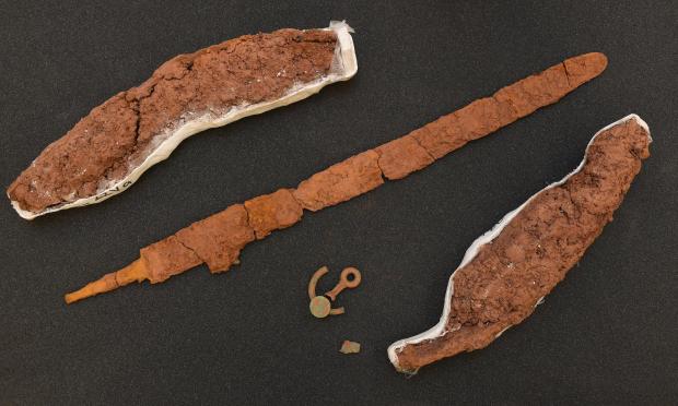 Tivyside Advertiser: Two chariot wheel sections, the sword and the bridle bit fragments. Picture: National Museum Wales