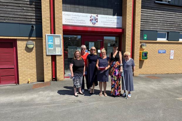 Tina Higgins, Sharon Lyle, Helen Palmer, Wendy Evans, Rebecca Simmons and Mary Rees presenting the petition to save Tycroes Surgery to the Hywel Dda Health Board