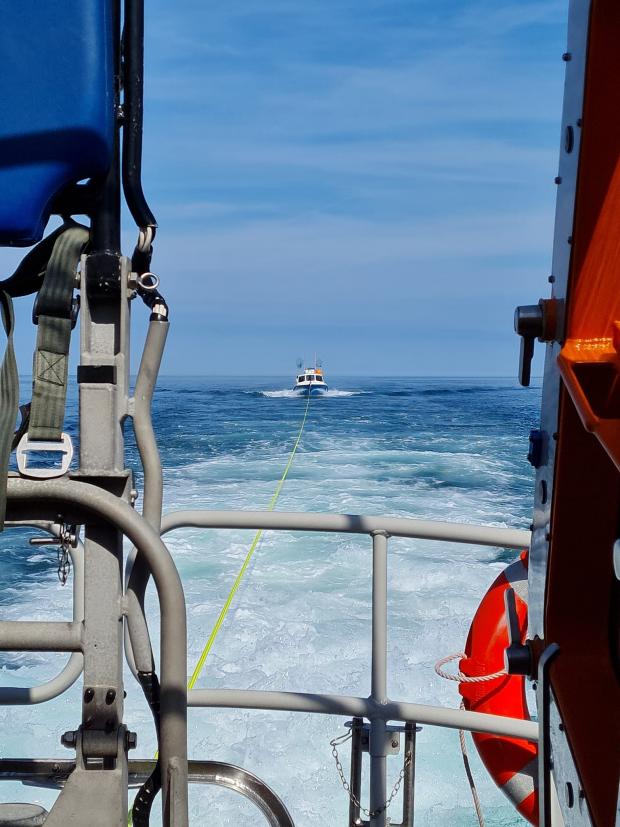 Tivyside Advertiser: A fishing boat in need of a tow by New Quay RNLI