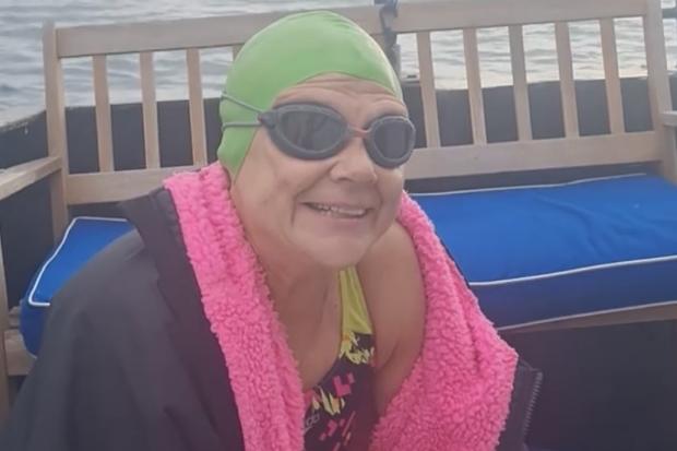 Tivyside Advertiser: Paula on the boat between swims