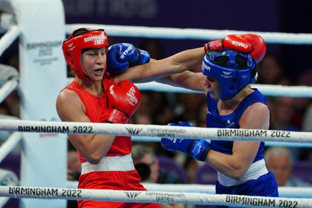 Australia's Kaye Frances Scott (Red) and Rosie Eccles for Wales (Blue) (Picture: PA Wire)