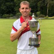 Cardigan bowler Kevin James with the trophy.