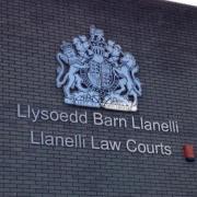 The defendant was remanded in custody to appear before Carmarthenshire magistrates sitting at Llanelli on January 5.