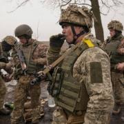 Ukrainian servicemen check their equipment. (PA)