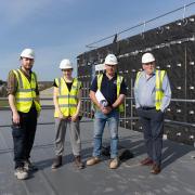 Level 3 NVQ bricklaying apprentice David Deeth (left); Willow Kehily, who also gained site experience; Bryn Roberts, Wynne Construction site manager and Paul Falzon, Cyfle Building Skills’ lead training co-ordinator. Picture: Wynn Construction.