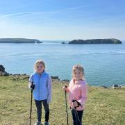 Oceana and Autumn having a break during their 182-mile trek across the Pembrokeshire Coastal Path