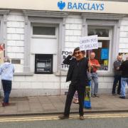 More than 1,000 Ceredigion residents have signed a petition calling on the council to stop using Barclays bank