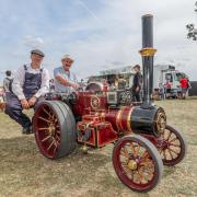 Dai Thomas (right), from Llandysul, shares a seat on this miniature steam engine at Onslow Park.