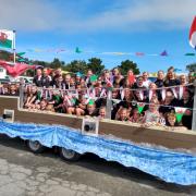 Lowri Jones dancers on their boat of a float. Picture: Western Telegraph