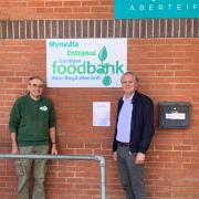 Mr Lake is pictured with Cardigan Foodbank manager Alan Faunch.