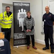 MS Joyce Watson is flanked by Rob Makepeace (MAWW Fire Service ) and Anthony Evans, of Dyfed-Powys Police.