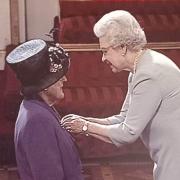 Mary Bott receives her MBE from her late Majesty, the Queen.