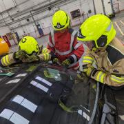 Mid and West Wales Fire and Rescue Service's firefighters benefit from training on how to get into locked vehicles. Picture: Tony Rich/AA