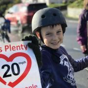 Local families have welcomed the scheme – pictured is Finley from St Dogmaels campaigning for the 20mph limit in 2021.