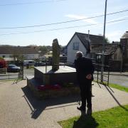 Mick Kendal, chairman of St Dogmaels Community Council, laying a Wreath of Remembrance at the War Memorial .